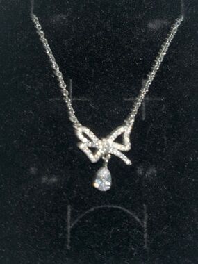 Anthropologie Silver Bow Pendant Necklace with Teardrop